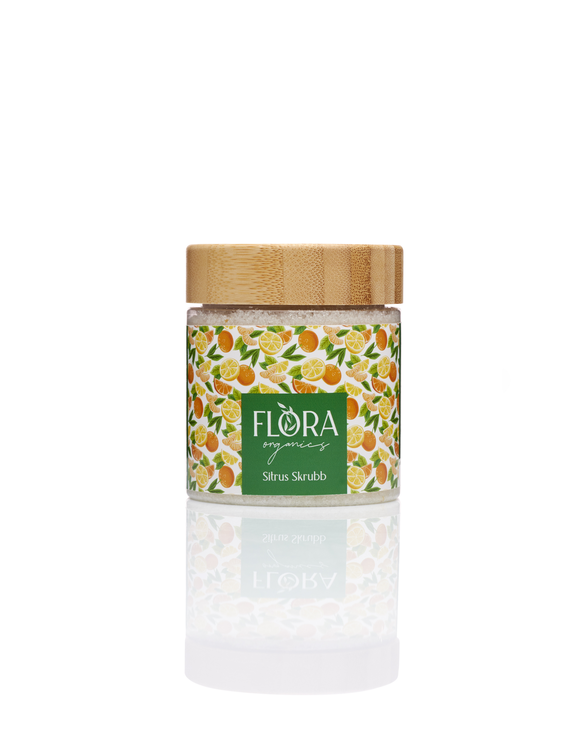 Flora Organics Citrus Scrub in glass jar with bamboo lid, reflected on white background