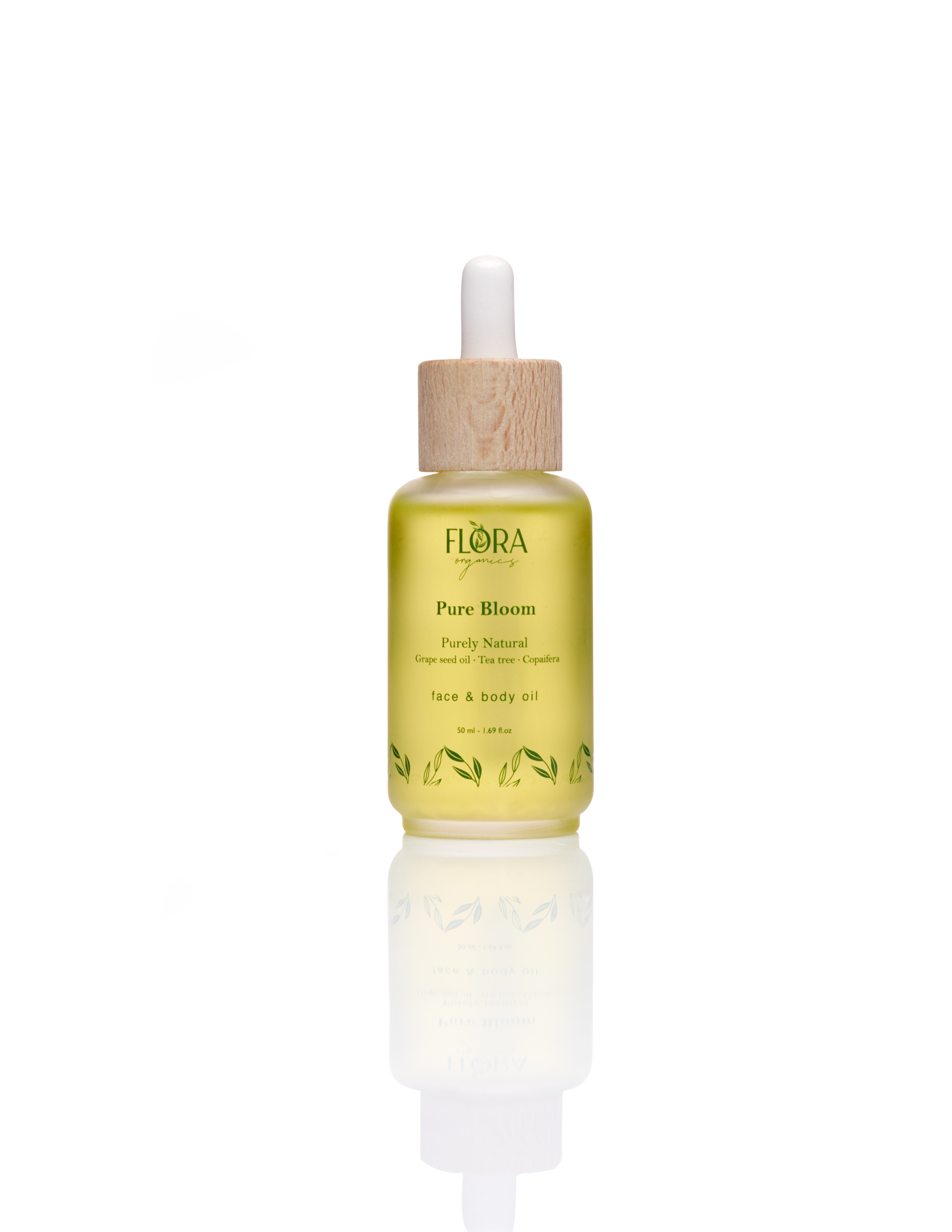 Flora Organics Pure Bloom Oil in frosted glass dropper bottle with wooden cap, reflected on white background